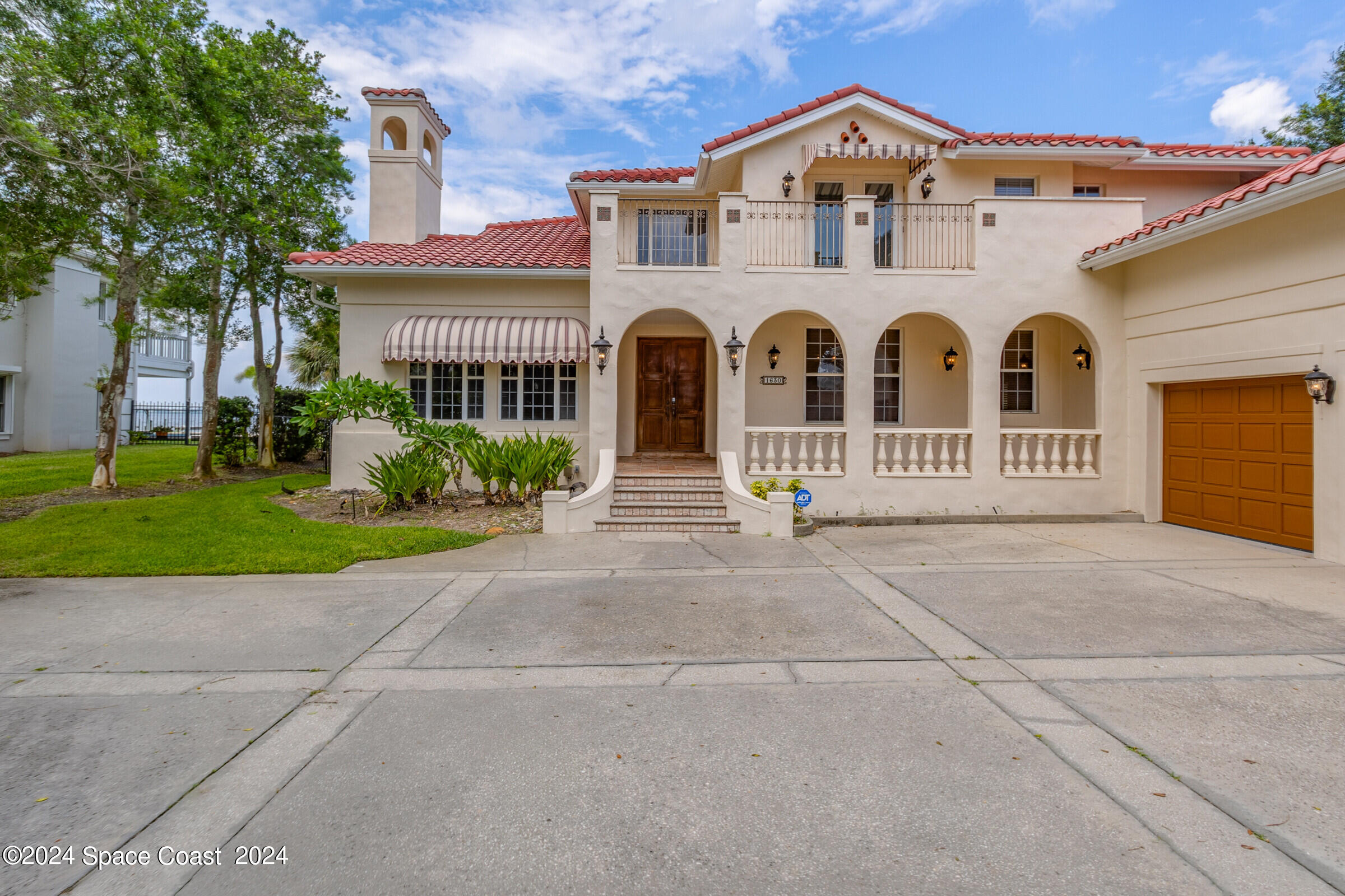 1630 Pine Street Melbourne Beach, FL 32951 - Photo 4 of 54 front view of a house with a yard