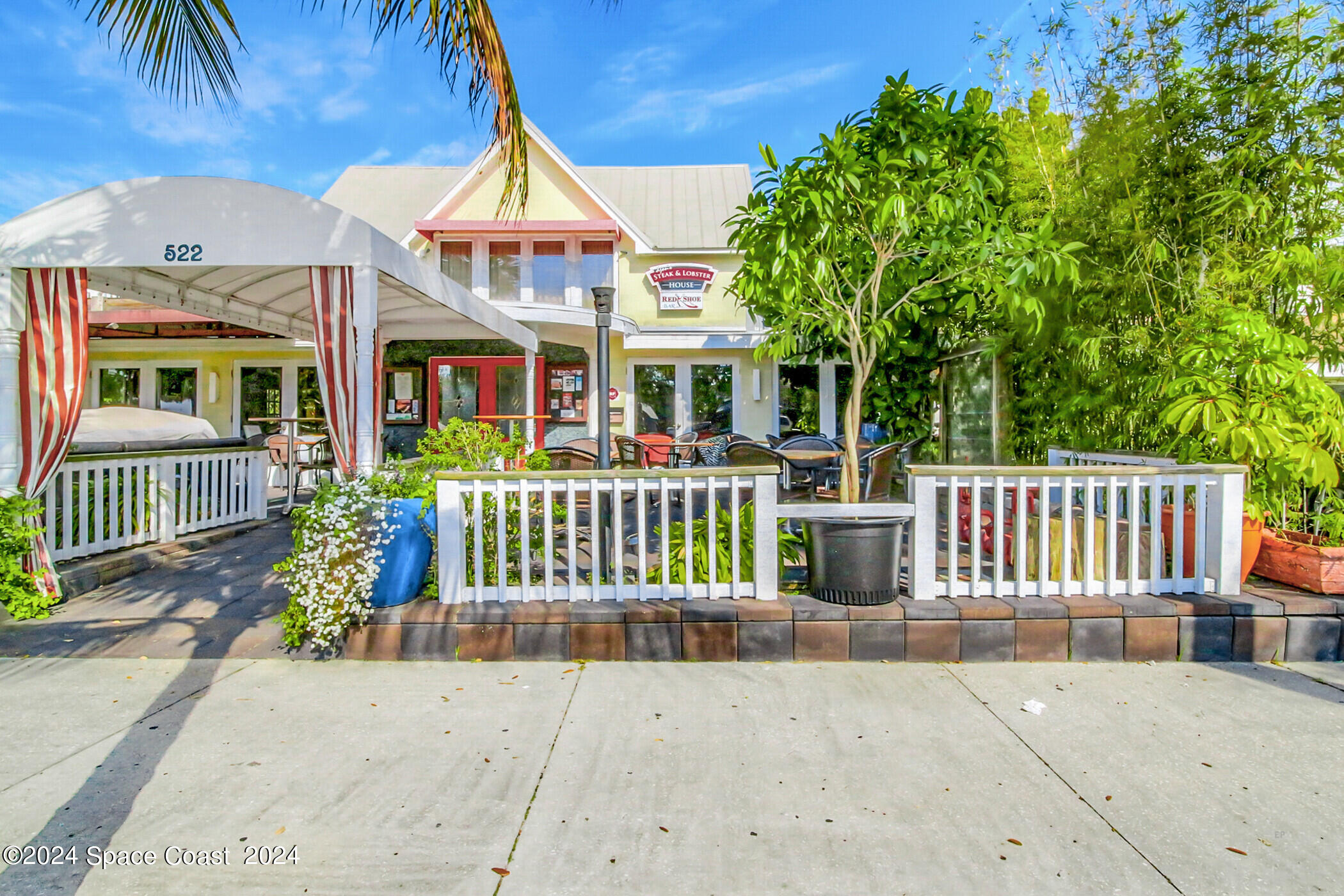 1630 Pine Street Melbourne Beach, FL 32951 - Photo 48 of 54 front view of a house with a porch