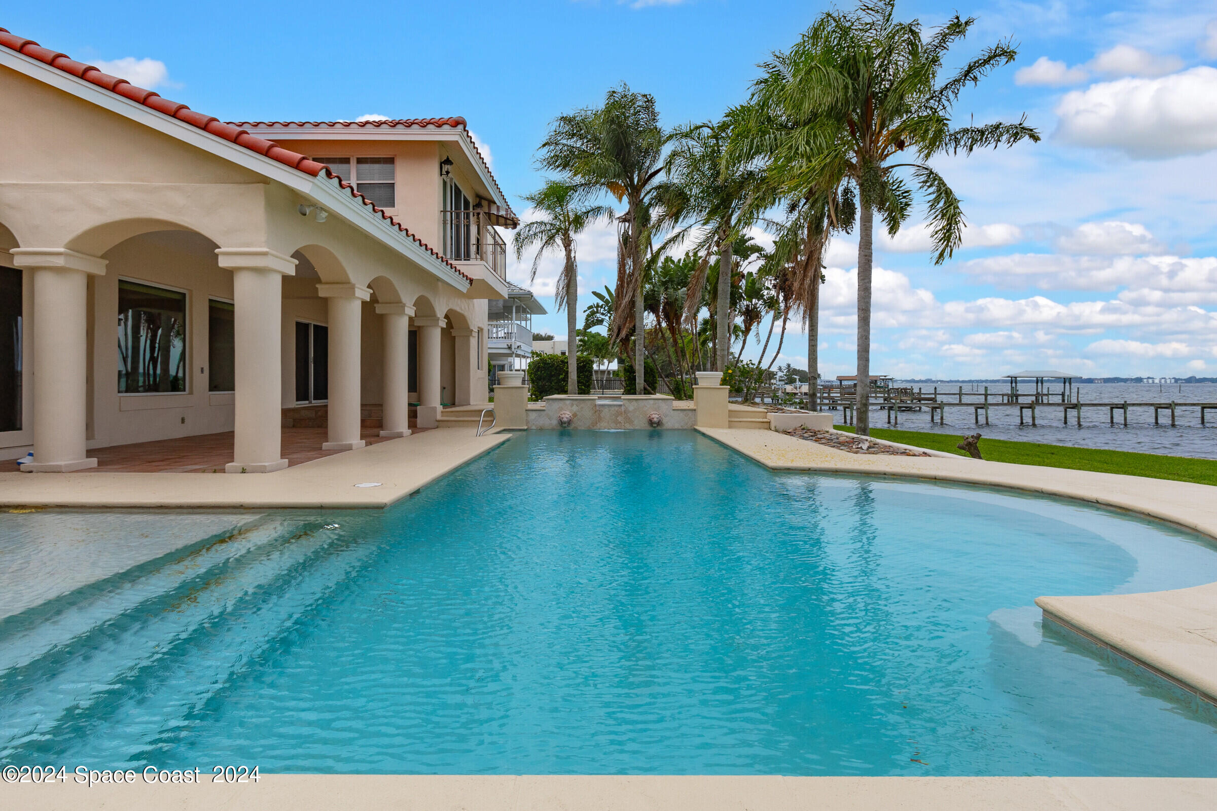 1630 Pine Street Melbourne Beach, FL 32951 - Photo 8 of 54 a view of a house with swimming pool
