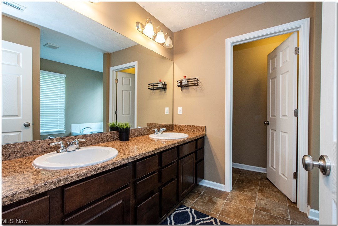 156 Burwick Road Cleveland, OH 44143 - Photo 22 of 31 DOUBLE SINKS IN EN SUITE BATHROOM