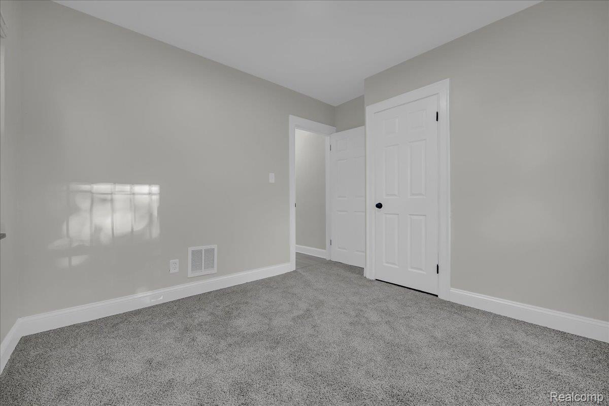 16717 Fielding Street Detroit, MI 48219 - Photo 24 of 46 Unfurnished bedroom with baseboards and carpet flooring