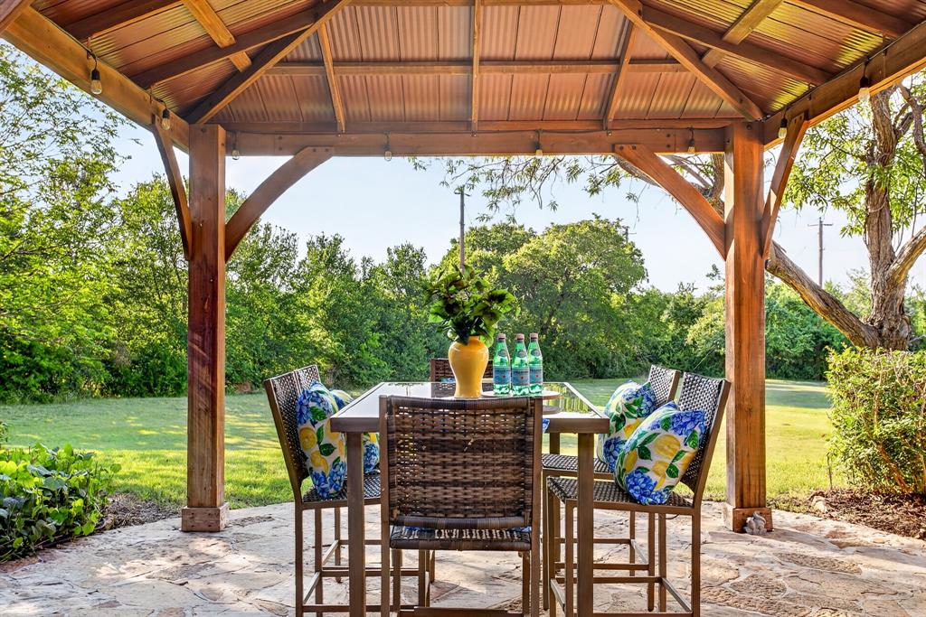 128 Canyon Ridge Trail Aledo, TX 76008 - Photo 35 of 40 Back porch area has been extended with patio space and a lovely covered gazebo.