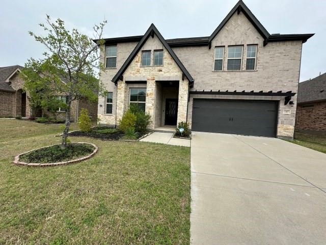 1307 Wheelwright Drive Forney, TX 75126 - Photo 1 of 25 a front view of a house with a yard garage and outdoor seating