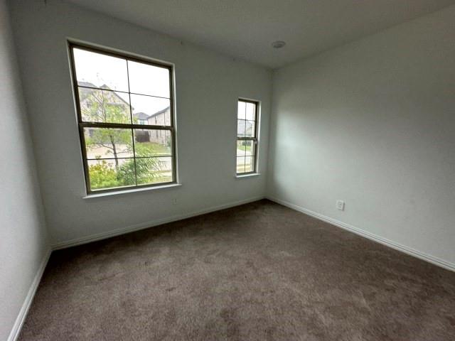 1307 Wheelwright Drive Forney, TX 75126 - Photo 17 of 25 an empty room with windows