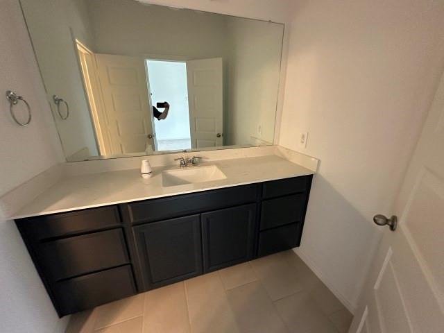 1307 Wheelwright Drive Forney, TX 75126 - Photo 24 of 25 a bathroom with a sink and a mirror