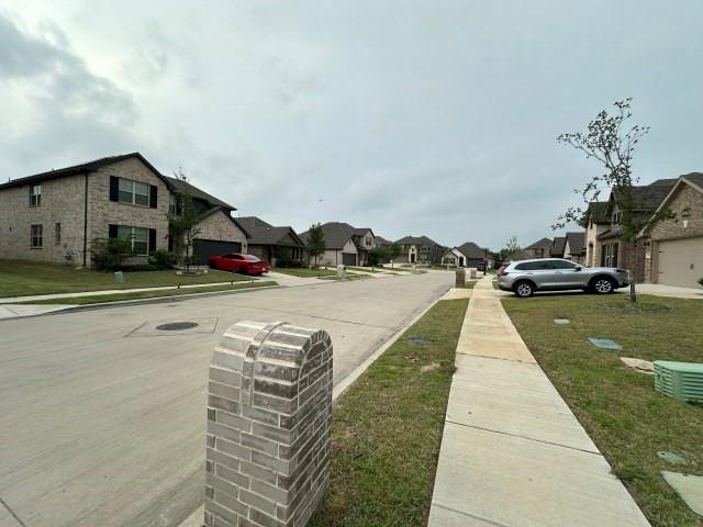 1307 Wheelwright Drive Forney, TX 75126 - Photo 4 of 25 a view of street with parked cars