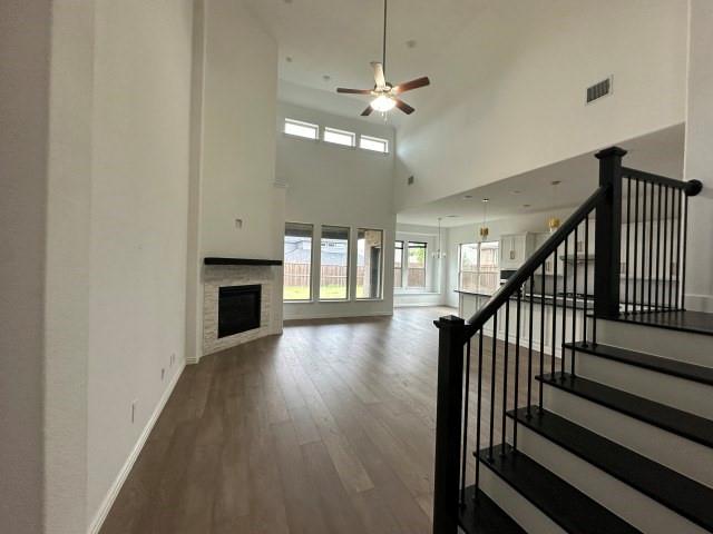 1307 Wheelwright Drive Forney, TX 75126 - Photo 5 of 25 wooden floor in an empty room with a fireplace