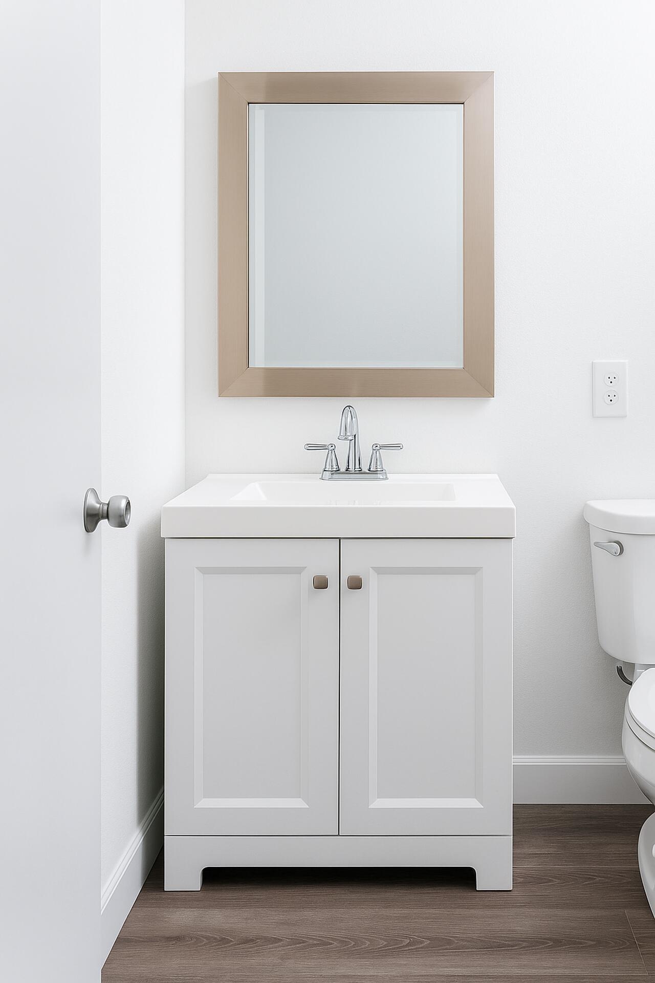 4850 Northeast 5th Avenue, Unit 110 Boca Raton, FL 33431 - Photo 8 of 13 a bathroom with a sink a toilet and a mirror