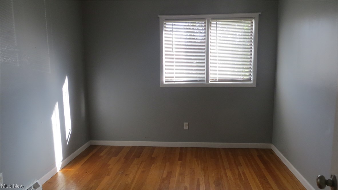6490 Elmdale Road Cleveland, OH 44130 - Photo 15 of 17 Spare room featuring hardwood / wood-style flooring