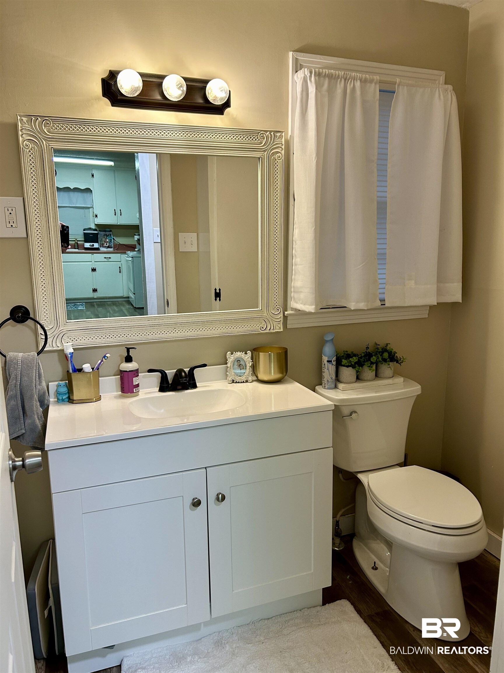 3850 Newman Road Mobile, AL 36695 - Photo 8 of 27 Bathroom featuring hardwood / wood-style floors, vanity, and toilet