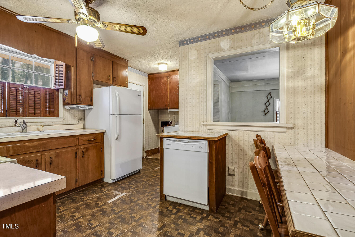 6320 Buffaloe Road Raleigh, NC 27604 - Photo 18 of 50 a kitchen with refrigerator cabinets and a fireplace