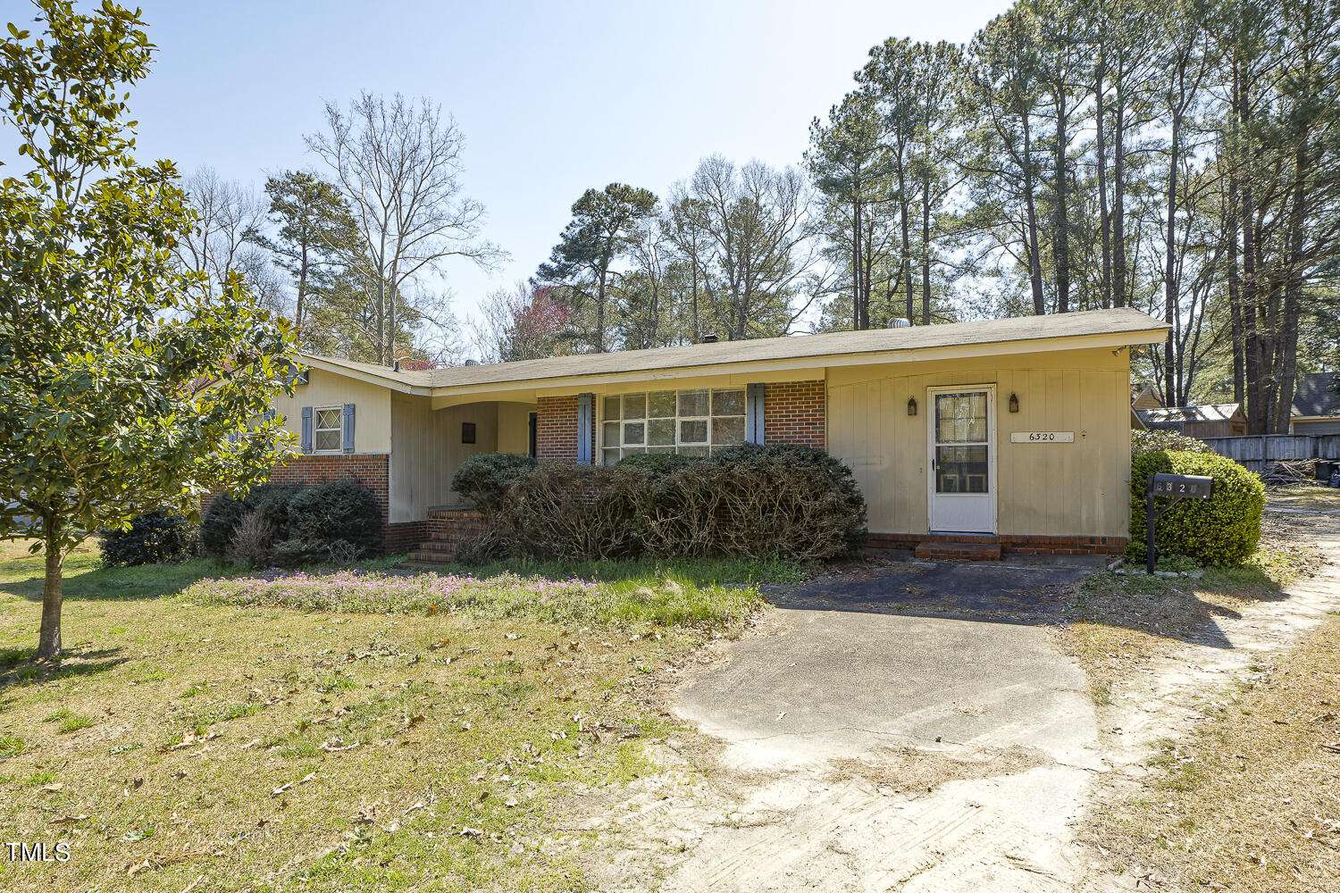 6320 Buffaloe Road Raleigh, NC 27604 - Photo 3 of 50 a front view of a house with a yard and garage
