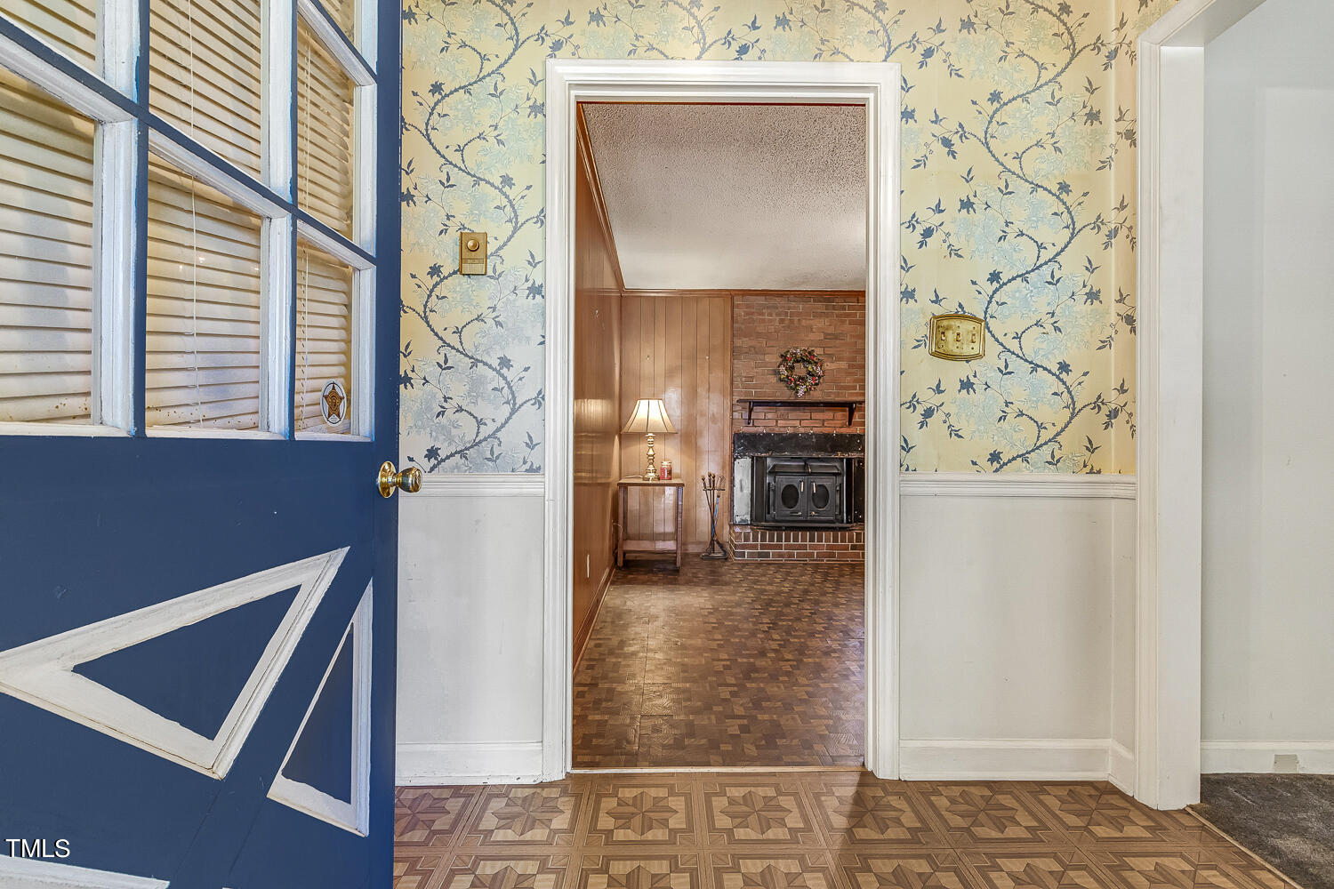 6320 Buffaloe Road Raleigh, NC 27604 - Photo 7 of 50 a view of a hallway with wooden floor and windows
