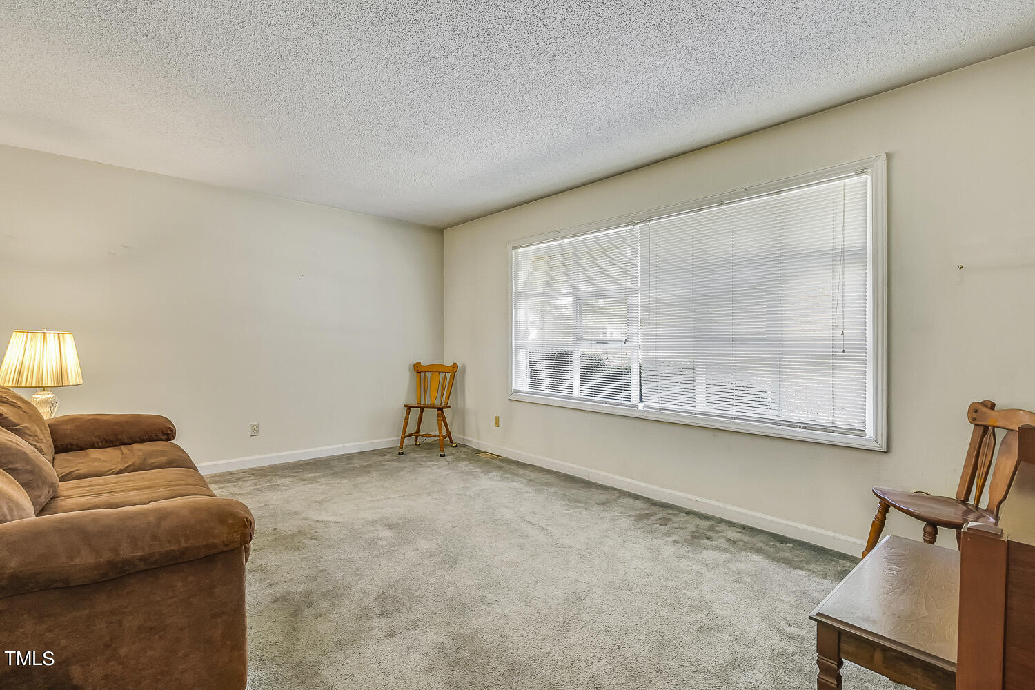 6320 Buffaloe Road Raleigh, NC 27604 - Photo 10 of 50 a living room with furniture and a window