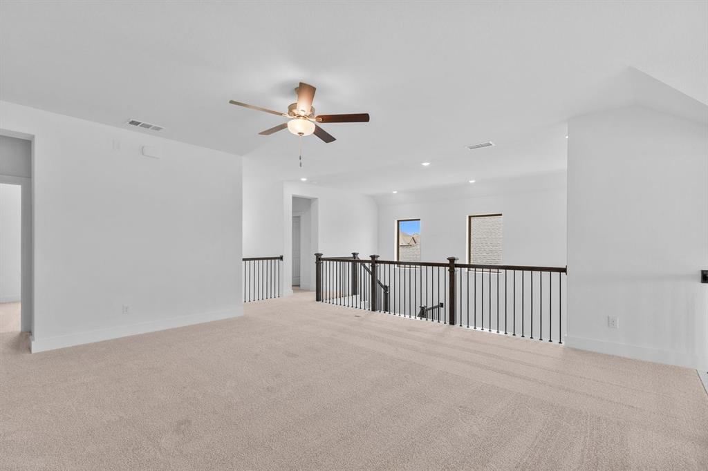 1124 Hitching Post Way Oak Point, TX 75068 - Photo 28 of 34 a view of a room with ceiling fan