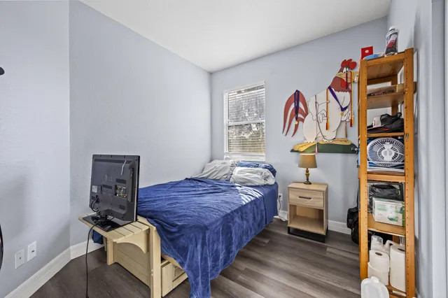 a bedroom with bed and a closet