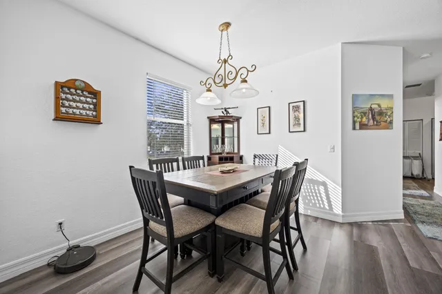 a dining room with furniture and window