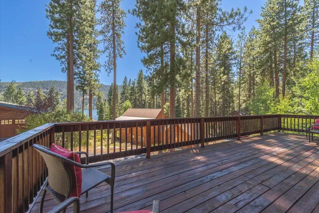 a view of balcony with wooden floor and outdoor seating
