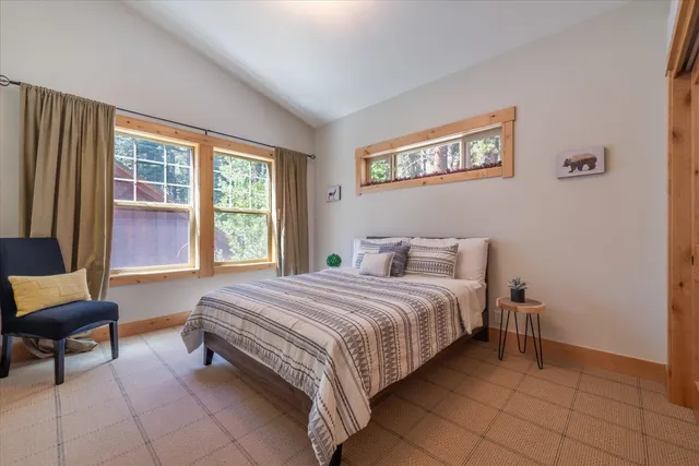 a spacious bedroom with a bed and a couch