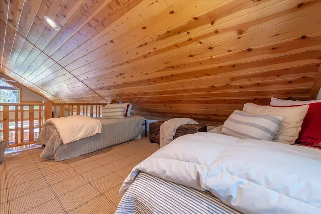 a bedroom with two beds and a walk in closet