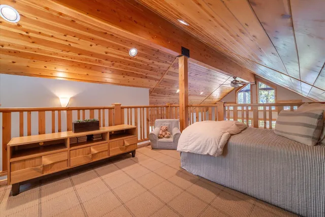 a bedroom with furniture and a window