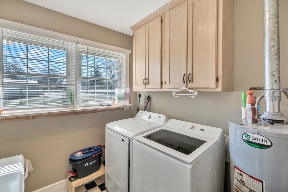 105 West Church Street Iva, SC 29655 - Photo 12 of 25 This dedicated laundry space combines functionality with thoughtful storage solutions for everyday convenience.