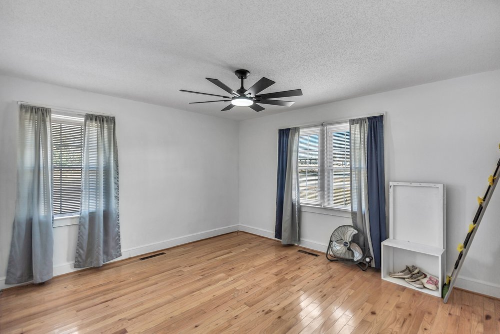105 West Church Street Iva, SC 29655 - Photo 20 of 25 This bright room features durable hardwood floors and ample natural light.