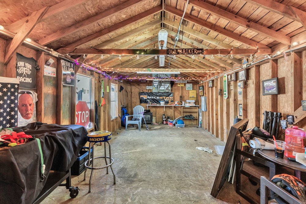 105 West Church Street Iva, SC 29655 - Photo 21 of 25 This versatile shed offers abundant space and robust wooden construction, perfect for various uses.