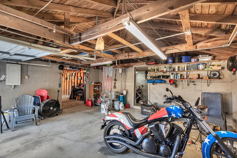 105 West Church Street Iva, SC 29655 - Photo 22 of 25 A well-lit garage offers practical space for storage and projects.