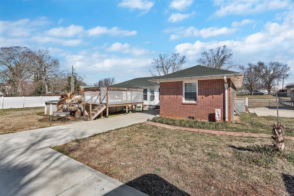 105 West Church Street Iva, SC 29655 - Photo 23 of 25 This residence showcases a well-maintained exterior with a private yard and inviting deck.
