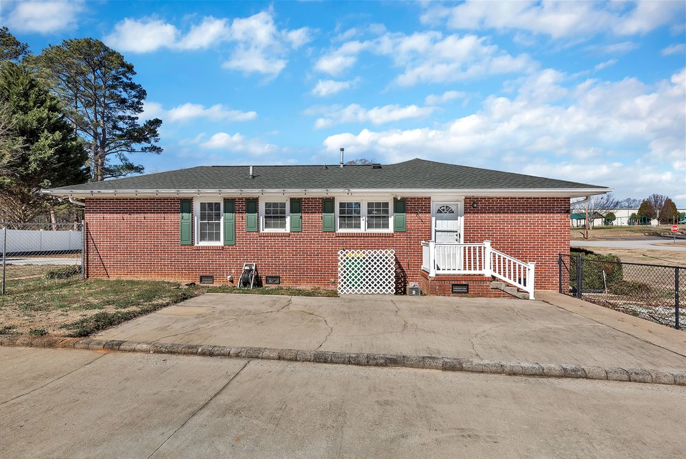 105 West Church Street Iva, SC 29655 - Photo 25 of 25 This classic brick residence features an inviting entrance and a well-maintained exterior.