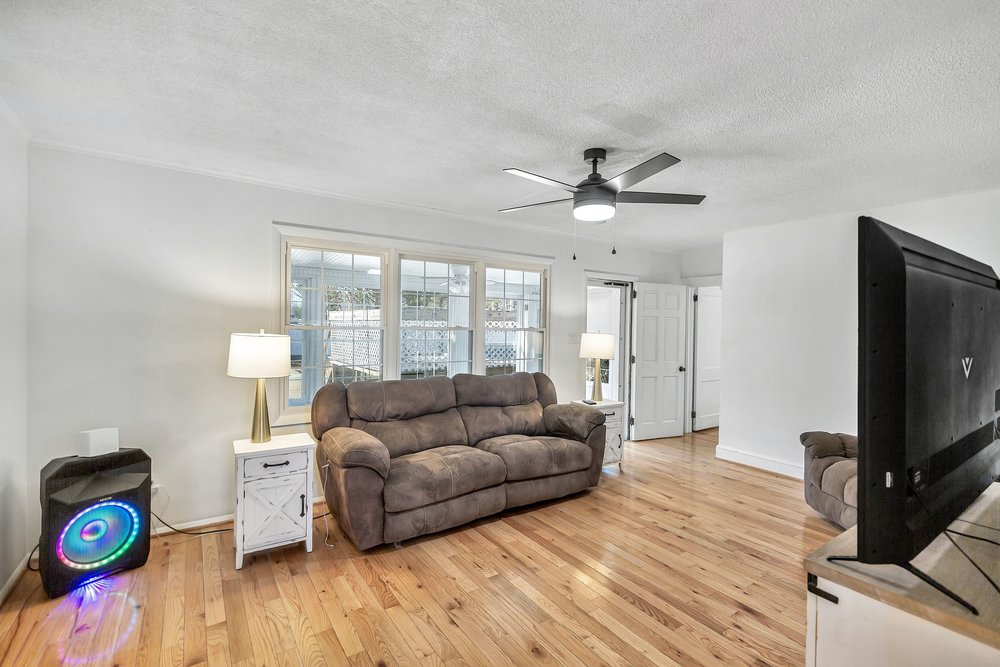 105 West Church Street Iva, SC 29655 - Photo 4 of 25 This inviting living area boasts rich hardwood floors and abundant natural light.