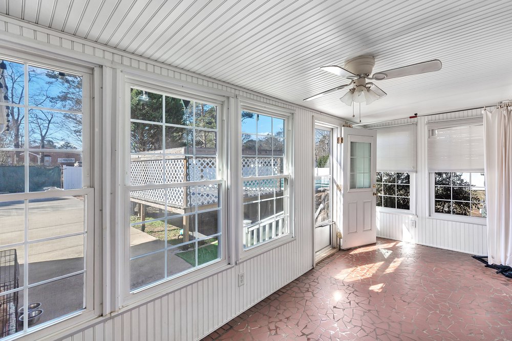 105 West Church Street Iva, SC 29655 - Photo 7 of 25 This sunroom offers abundant natural light and an inviting space for relaxation.