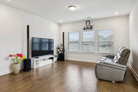 a living room with furniture window and flat screen tv