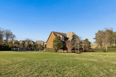 a view of an ocean with a house in the background