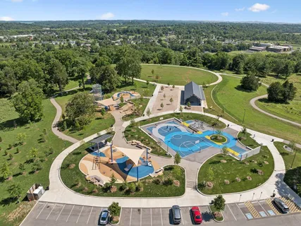 an aerial view of a house with a swimming pool