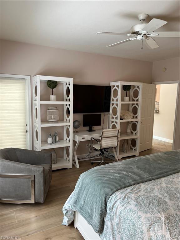 901 Egrets Run, Unit 4102 Naples, FL 34108 - Photo 18 of 27 a bedroom with a bed a couch and dresser