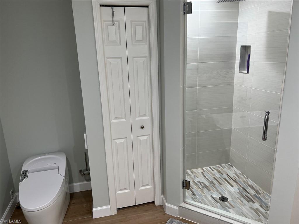 901 Egrets Run, Unit 4102 Naples, FL 34108 - Photo 21 of 27 a bathroom with a toilet and a shower