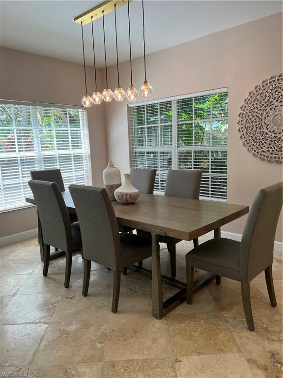 901 Egrets Run, Unit 4102 Naples, FL 34108 - Photo 4 of 27 a view of a dining room with furniture window and outside view