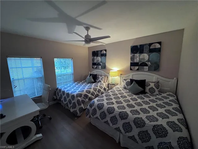 a bedroom with double bed and a window