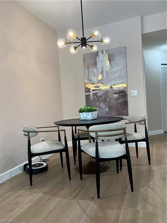901 Egrets Run, Unit 4102 Naples, FL 34108 - Photo 8 of 27 a view of a dining room with furniture