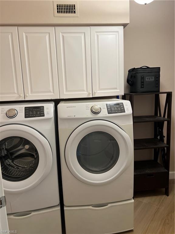 901 Egrets Run, Unit 4102 Naples, FL 34108 - Photo 10 of 27 a utility room with dryer and washer