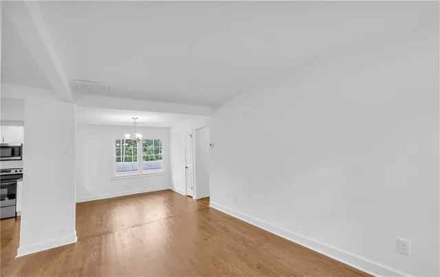 a kitchen with a refrigerator and sink