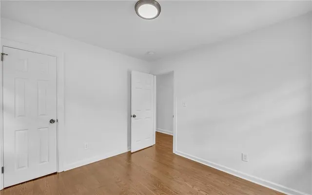 a bathroom with a bathtub and a window