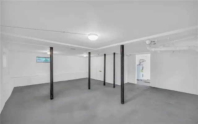 a view of a storage & utility room with a window