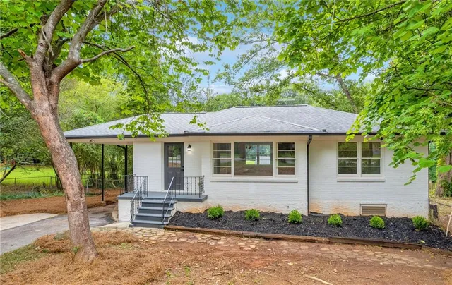 a backyard of a house with lots of green space