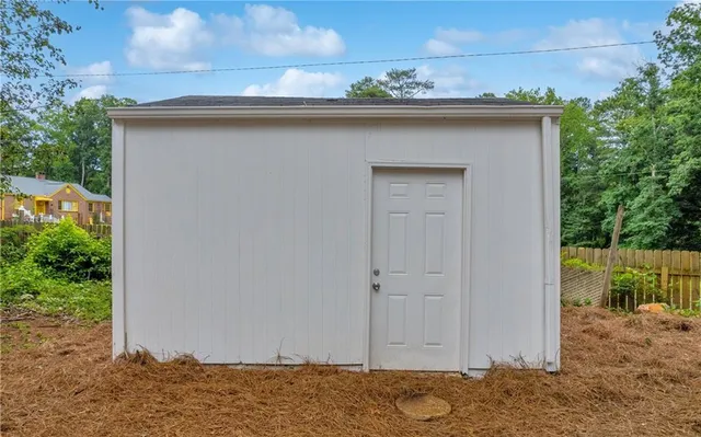 a view of a city with lush green forest