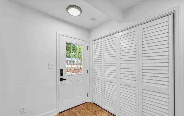 a view of kitchen with furniture and wooden floor
