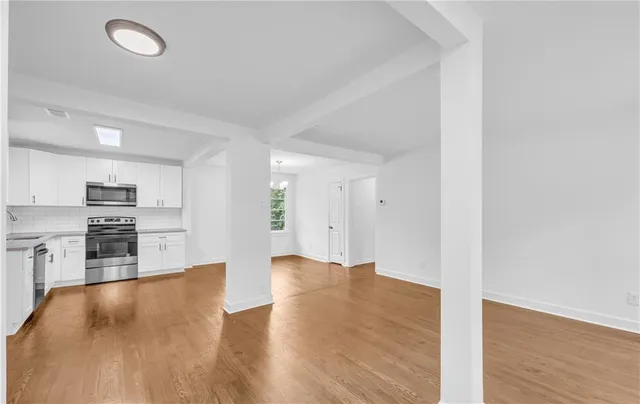 a view of an empty room with a window