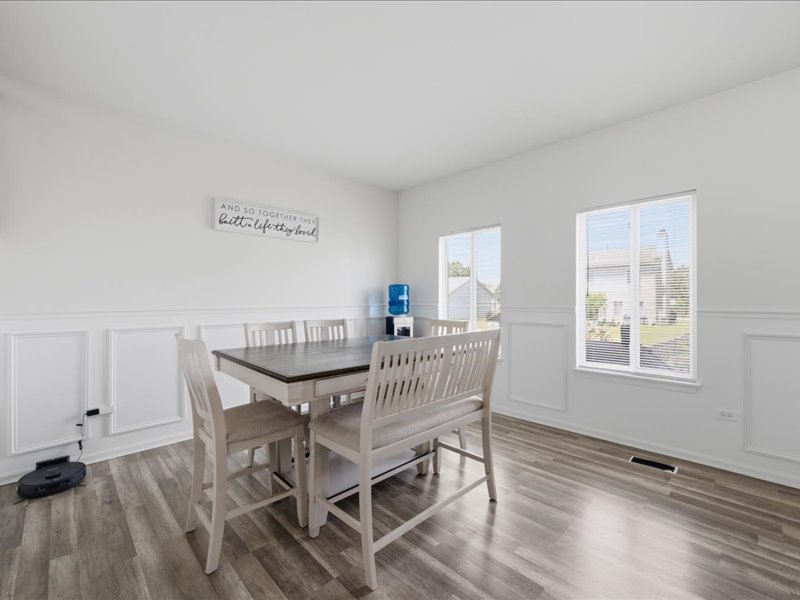 4201 Dillon Street Plano, IL 60545 - Photo 15 of 37 a view of a dining room with furniture and wooden floor